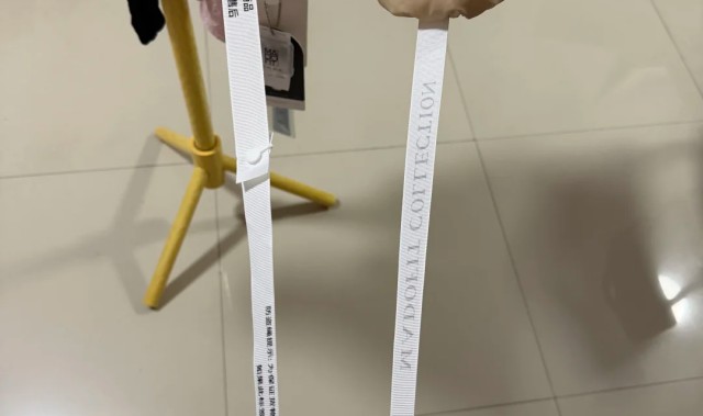 江南体育-商家防“蹭穿”与恶意退货出新招：继“比脸还大的吊牌”后又推超半米“防盗绳”